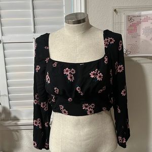 Off the shoulder if wanted, floral black top